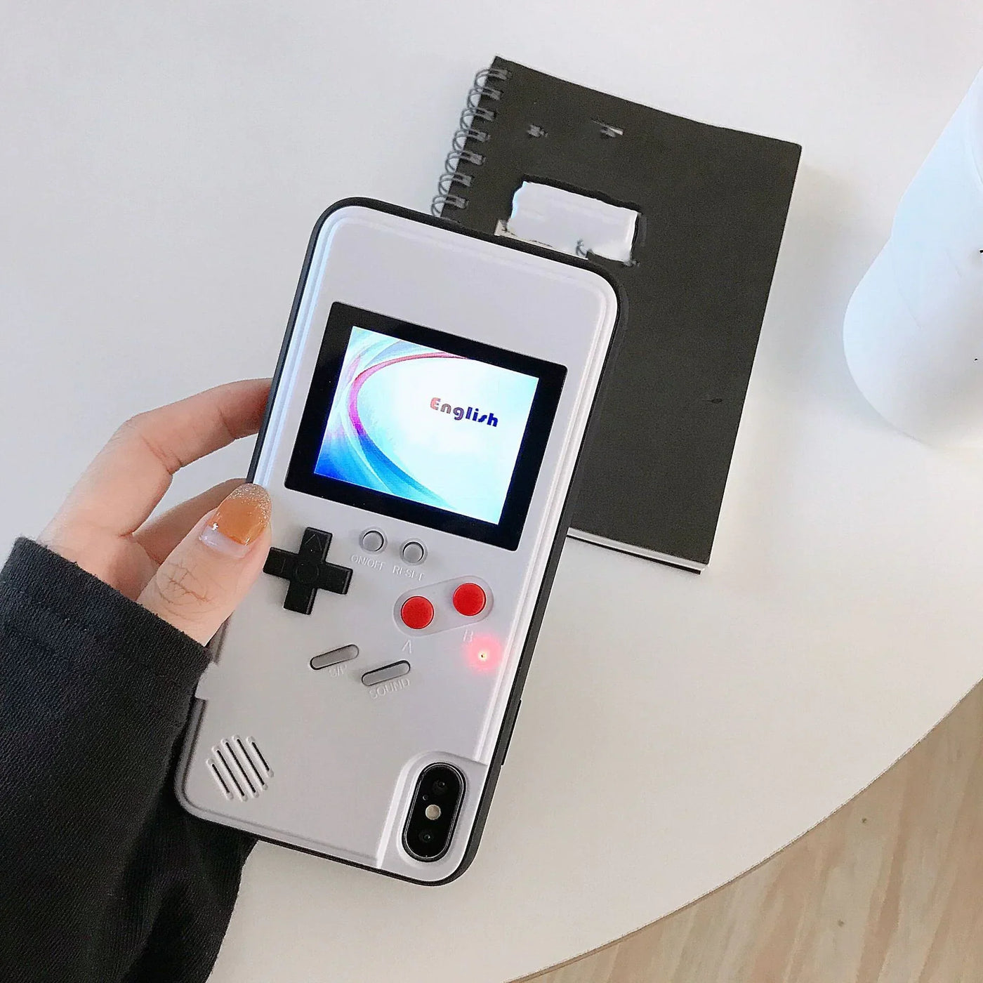 Retro Gameboy Phone Case Retro Gameboy-style phone case with classic button design.